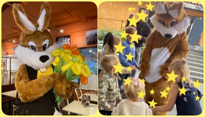 Maskot som sjunger och spelar till barn kanin
